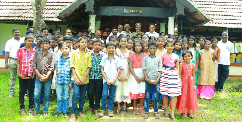 Group photo of children and organizers at “A day to celebrate ” event