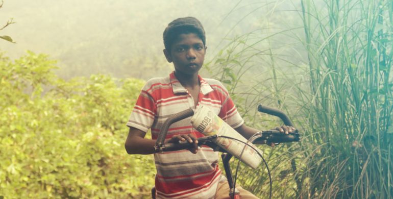 A paperboy fighting off poverty and pain